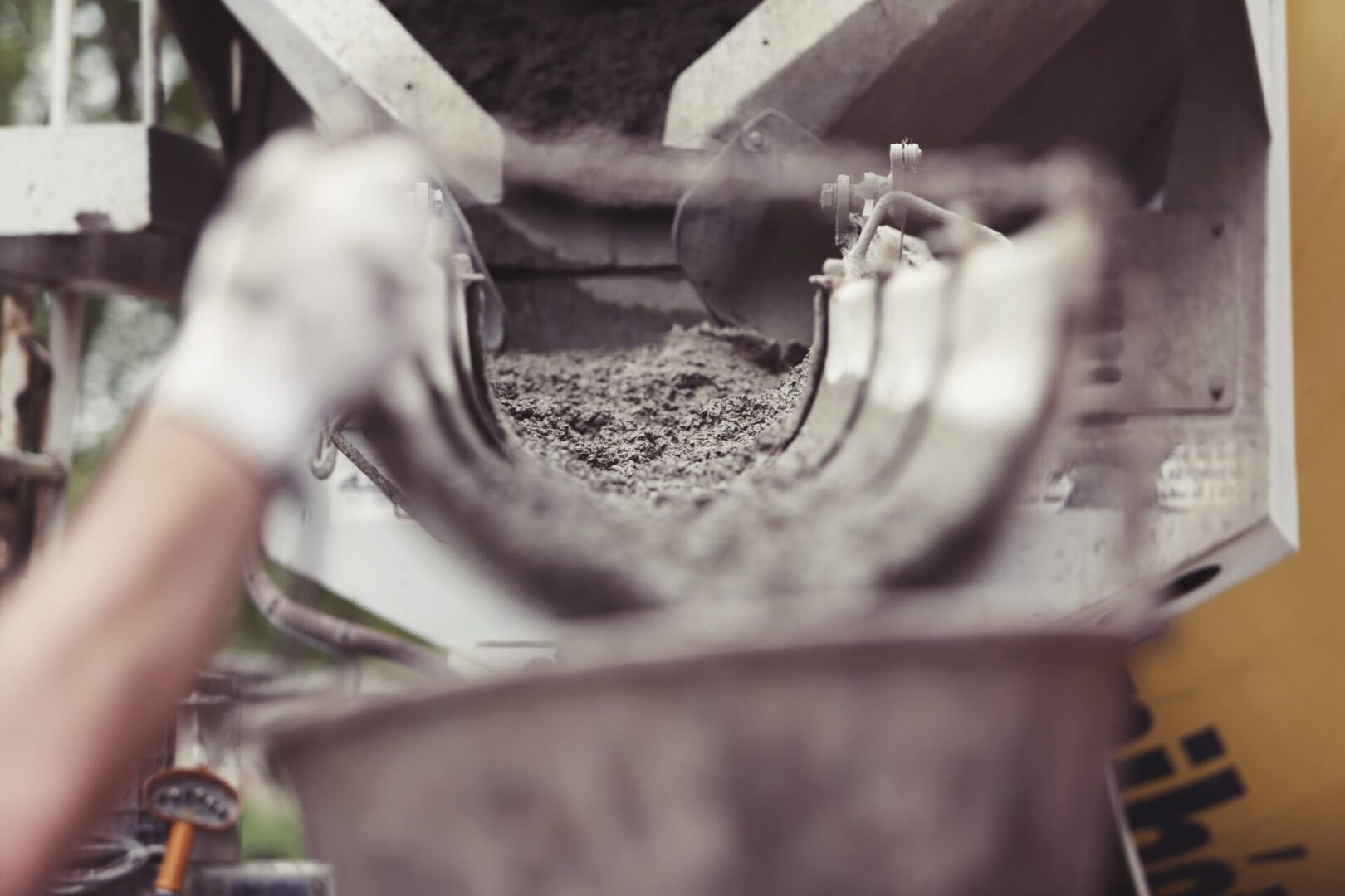 A person is working on a cement machine.