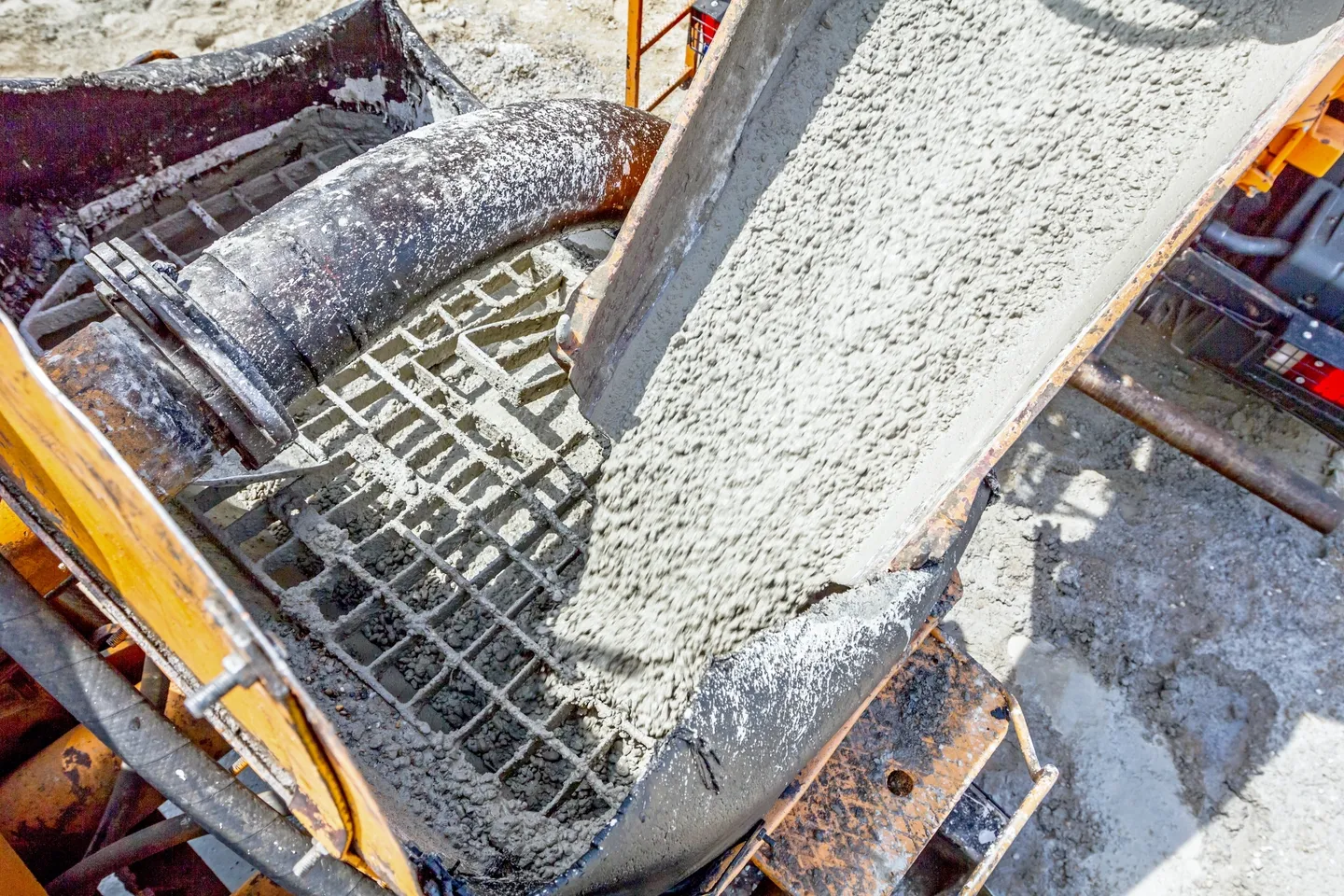 A cement mixer is being used to mix concrete.